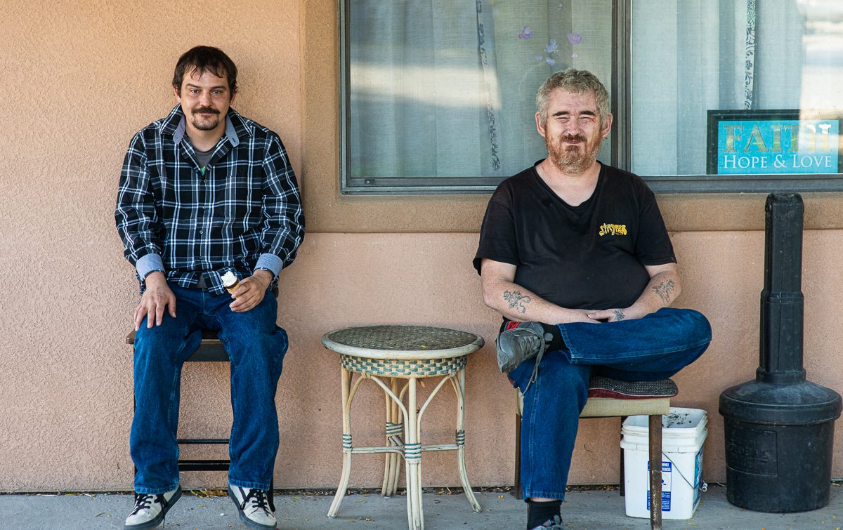Residents sitting together on the porch